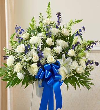 Heartfelt Sympathies Blue & White Standing Basket Heartfelt Sympathies Blue & White Standing Basket - Product ID: 91266 Both simple and undeniably stunning, this standing basket arrangement is a beautiful way for you to convey your deepest sympathies. Delicately crafted by our expert florists craft this arrangement, itâs a touching tribute for family, friends, or business associates to send to the services. Standing basket arrangement of fresh blue and white flowers such as roses, hybrid lilies, snapdragons, delphinium and more Appropriate for family, friends or business associates to send directly to the funeral home Our florists use only the freshest flowers available, so colors and varieties may vary Large measures approximately 36"H x 38"L without stand Medium measures approximately 32"H x 36"L without stand Small measures approximately 30"H x 32"L without stand Stand may not be available in all areas due to availability