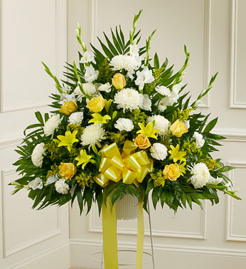 Heartfelt Sympathies Yellow Standing Basket - Product ID: 91263   It is customary to honor a life well lived with a final tribute that not only commemorates that life, but offers a message of hope and love to the family and friends left behind. This standing sympathy basket, crafted by our expert florists, is filled with yellow and white blooms, creating a touching and heartfelt memorial. Standing basket arrangement of fresh yellow and white flowers such as roses, lilies, mums, carnations and more Appropriate for family, friends or business associates to send directly to the funeral home Our florists use only the freshest flowers available, so colors and varieties may vary Large measures approximately 38&quot;H x 38&quot;L without stand Medium measures approximately 32&quot;H x 36&quot;L without stand Small measures approximately 30&quot;H x 34&quot;L without stand Stand may not be available in all areas