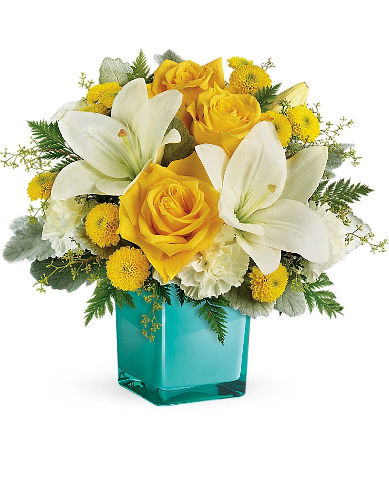 Teleflora's Golden Laughter Bouquet - Inspired by the sunny sound of children's laughter this lighthearted bouquet of golden roses and fragrant white lilies is presented in a stunning aqua cube vase. What a stylish way to make someone smile! This cheerful bouquet features yellow roses white asiatic lilies white carnations yellow button spray chrysanthemums seeded eucalyptus dusty miller and leatherleaf fern. Delivered in a glass cube.Approximately 14 3/4&quot; W x 13&quot; H