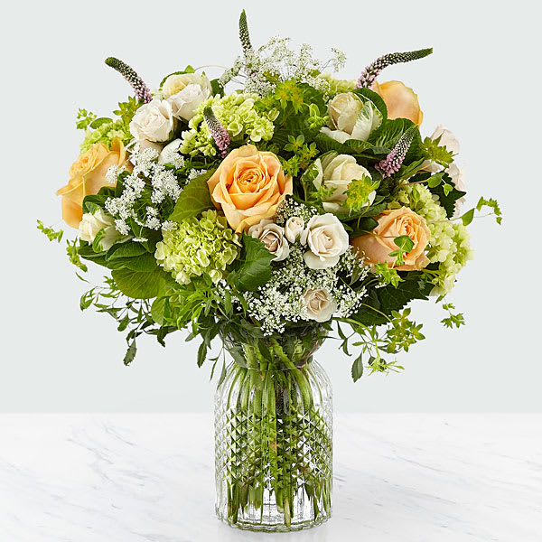 The FTD Sweet Amor Bouquet - Soft pastels and lush greens dominate this sweet and beautiful bouquet. Hydrangea roses Veronica ornamental kale and Queen Anne&rsquo;s lace were picked fresh. Each was artfully arranged in a clear textured glass vase to create a bouquet that emits a casual sort of elegance perfect for any occasion. GOOD bouquet is approx. 15&quot;H x 13&quot;W. BETTER bouquet is approx. 17&quot;H x 14&quot;W. BEST bouquet is approx. 18&quot;H x 16&quot;W.