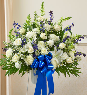 Heartfelt Sympathies Blue &amp; White Standing Basket - Product ID: 91266   Both simple and undeniably stunning, this standing basket arrangement is a beautiful way for you to convey your deepest sympathies. Delicately crafted by our expert florists craft this arrangement, itâs a touching tribute for family, friends, or business associates to send to the services. Standing basket arrangement of fresh blue and white flowers such as roses, hybrid lilies, snapdragons, delphinium and more Appropriate for family, friends or business associates to send directly to the funeral home Our florists use only the freshest flowers available, so colors and varieties may vary Large measures approximately 36&quot;H x 38&quot;L without stand Medium measures approximately 32&quot;H x 36&quot;L without stand Small measures approximately 30&quot;H x 32&quot;L without stand Stand may not be available in all areas due to availability