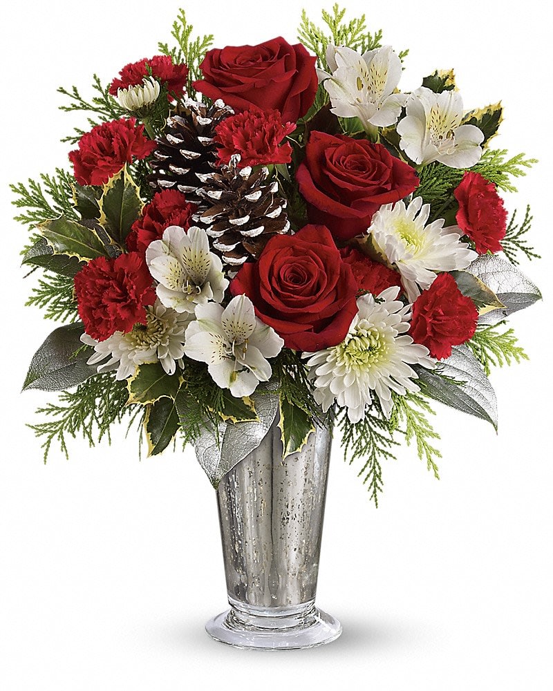 Teleflora's Timeless Cheer Bouquet Teleflora's Timeless Cheer Bouquet - Celebrate winter in style with vintage mercury glass and a timeless red rose and winter greens bouquet for an absolutely elegant gift! Beautiful red roses white alstroemeria miniature red carnations and white cushion chrysanthemums are arranged with variegated holly flat cedar silver lemon leaf and frosted pinecones. Delivered in an exclusive silver Mercury Glass large julep vase.