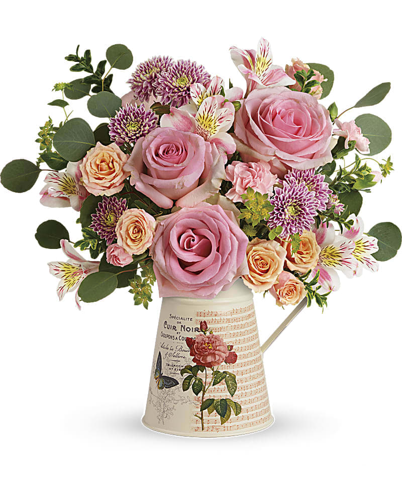 Teleflora&#039;s Vintage Chic Bouquet - Tres chic! With its charming vintage vibe and delicate bouquet of pink and peach roses, this hand-glazed metal water pitcher is the perfect Mother&#039;s Day treat! This chic bouquet includes pink roses, peach spray roses, white alstroemeria, pink miniature carnations, lavender cushion spray chrysanthemums, bupleurum, oregonia, and silver dollar eucalyptus. Delivered in a Mod Mademoiselle pitcher.