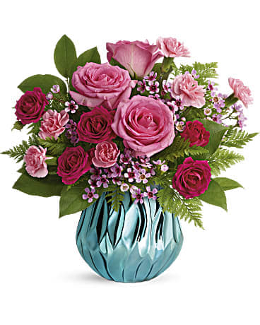 Gem Of My Heart Bouquet - Celebrate the sparkle that mom brings to your life with this glamorous gift of perfect pink roses, presented in a mirrored ceramic vase that shimmers in the loveliest shade of aqua! Pink roses, dark pink spray roses, pink miniature carnations, and lavender waxflower are arranged with leatherleaf fern and lemon leaf. Delivered in Teleflora's Gem of My Heart vase. Orientation: All-Around