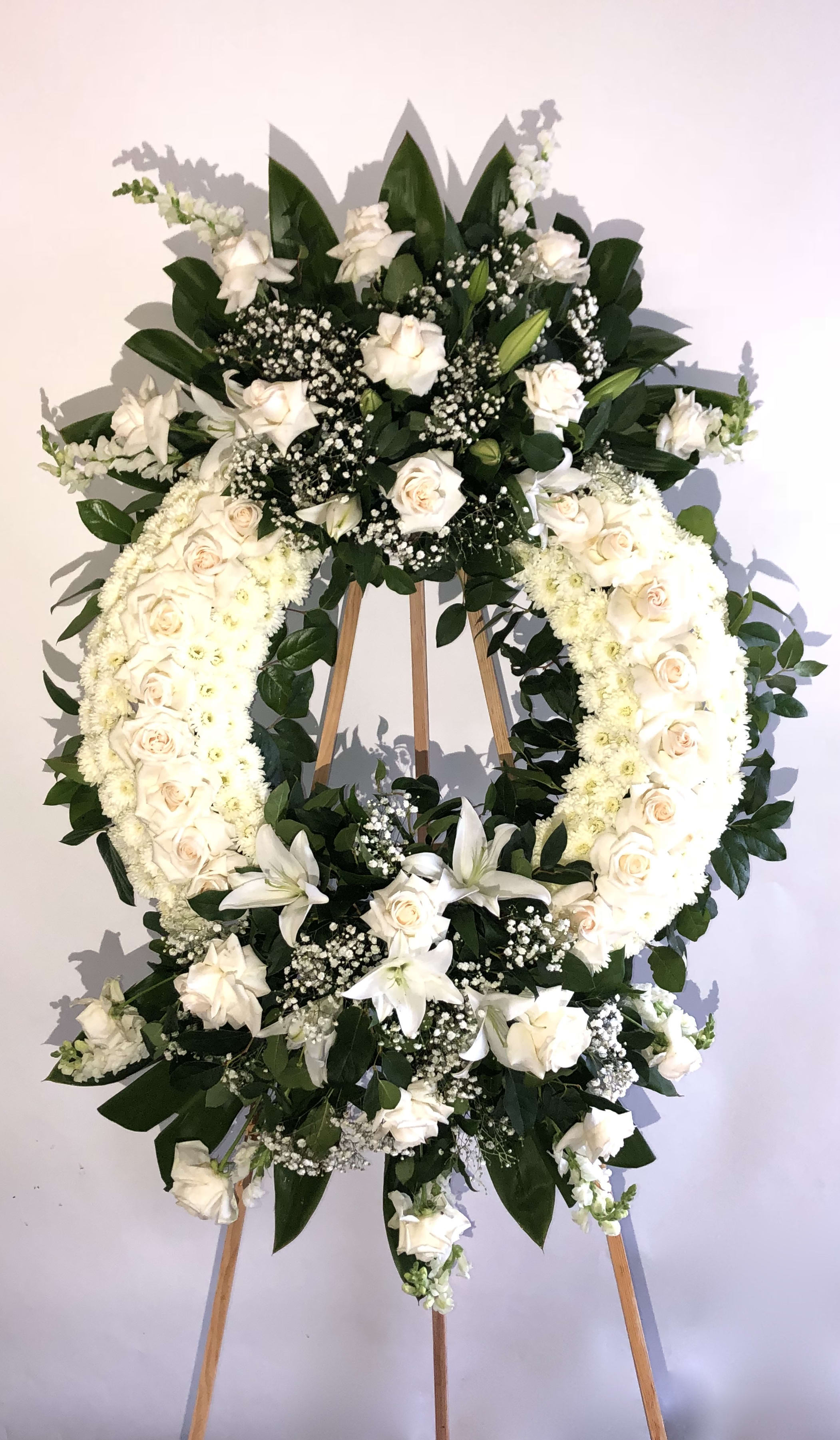 White wreath w/ two bouquet wreath White wreath w/ two bouquet wreath - white rose, withe lemon leafs with two bouquets.