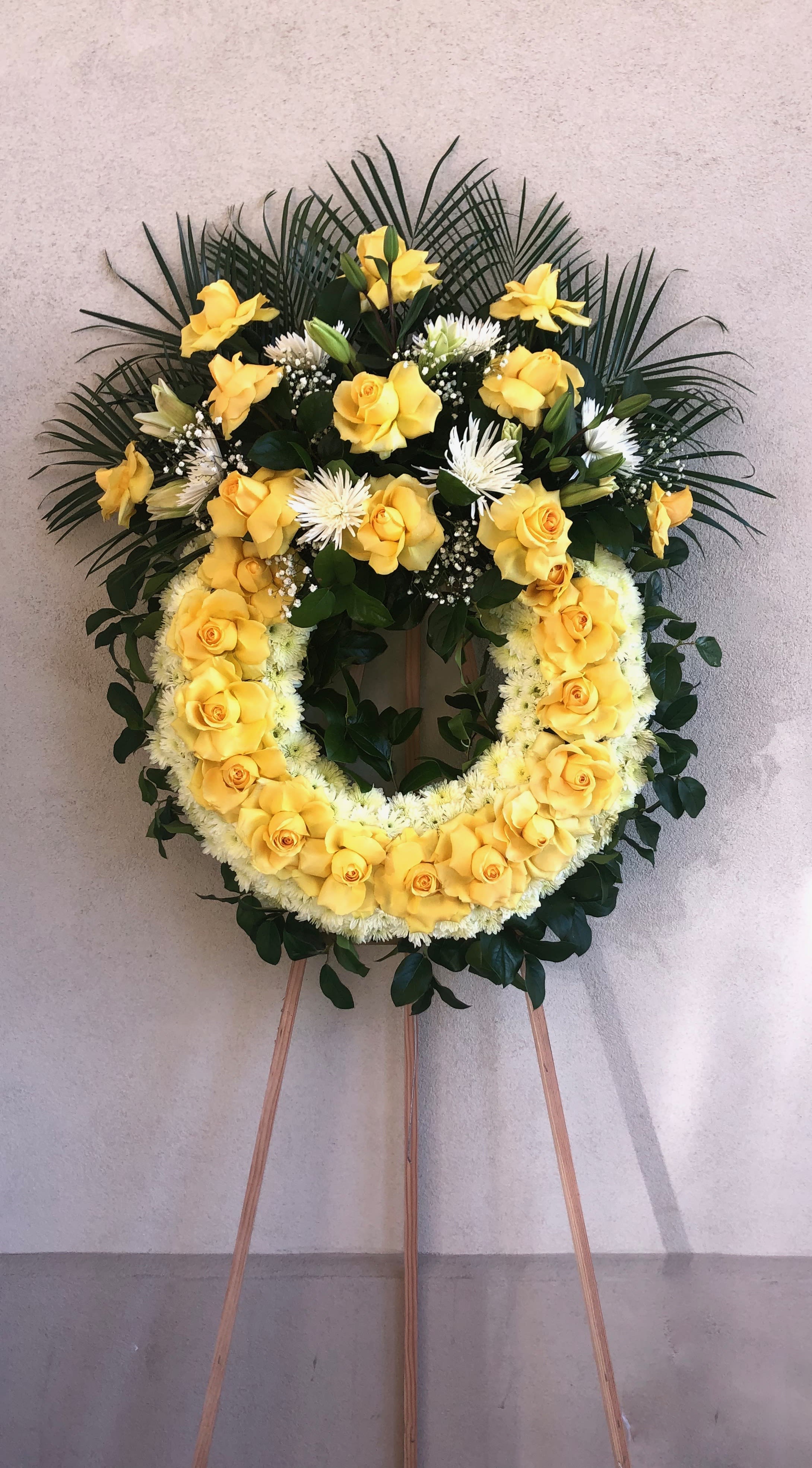 Full of life Full of life - Yellow medium wreath with roses , pom pom, babies breath, spider flower, closed lilies and lemon leafs