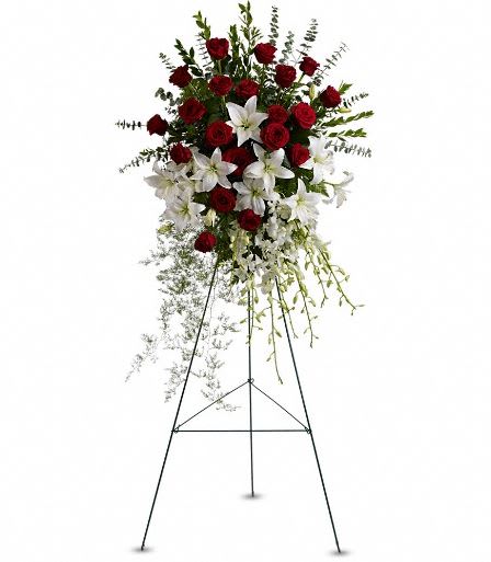 T226-1A Lily and Rose Tribute Spray T226-1A Lily and Rose Tribute Spray - Pure white lilies and dendrobium orchids mingle with red roses, white asiatic lilies and more in this magnificent and impressive standing spray of the finest blooms. A fitting tribute for a funeral, wake or memorial service. A standing spray of lush flowers such as red roses, white dendrobium orchids and asiatic lilies - accented with greenery - is delivered on an easel. Approximately 31" W x 50" H