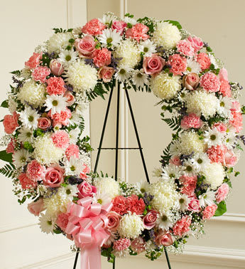 Serene Blessings Pink &amp; White Standing Wreath - Product ID: 91304   Finding the perfect expression of your care and concern during difficult times requires thoughtful consideration. This standing wreath, crafted from exquisite pink and white roses, carnations and more, beautifully reflects all the love and sympathy that is in your heart. Standing wreath arrangement of fresh pink and white flowers such as roses, alstroemeria, carnations and more Accented by babyâs breath, salal, heather and more Appropriate for family, friends and business associates to send directly to the funeral home Our florists use only the freshest flowers available, so colors and assortment may vary Large measures approximately 34âH x 34âW without easel Small measures approximately 30&quot;H x 30&quot;W without easel Easel may not be available in all areas