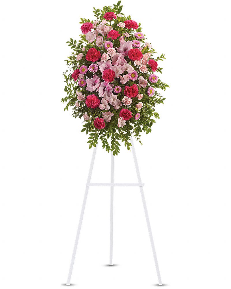 Pink Tribute Spray - With a bounty of lovely pink flowers and simple greens, this pretty spray lets you express your sympathy beautifully. Splendid pink, hot pink and light pink flowers such as alstroemeria, gladioli, carnations, asters and more create a display that is warm and loving.Approximately 22&quot; W x 31 1/2&quot; H