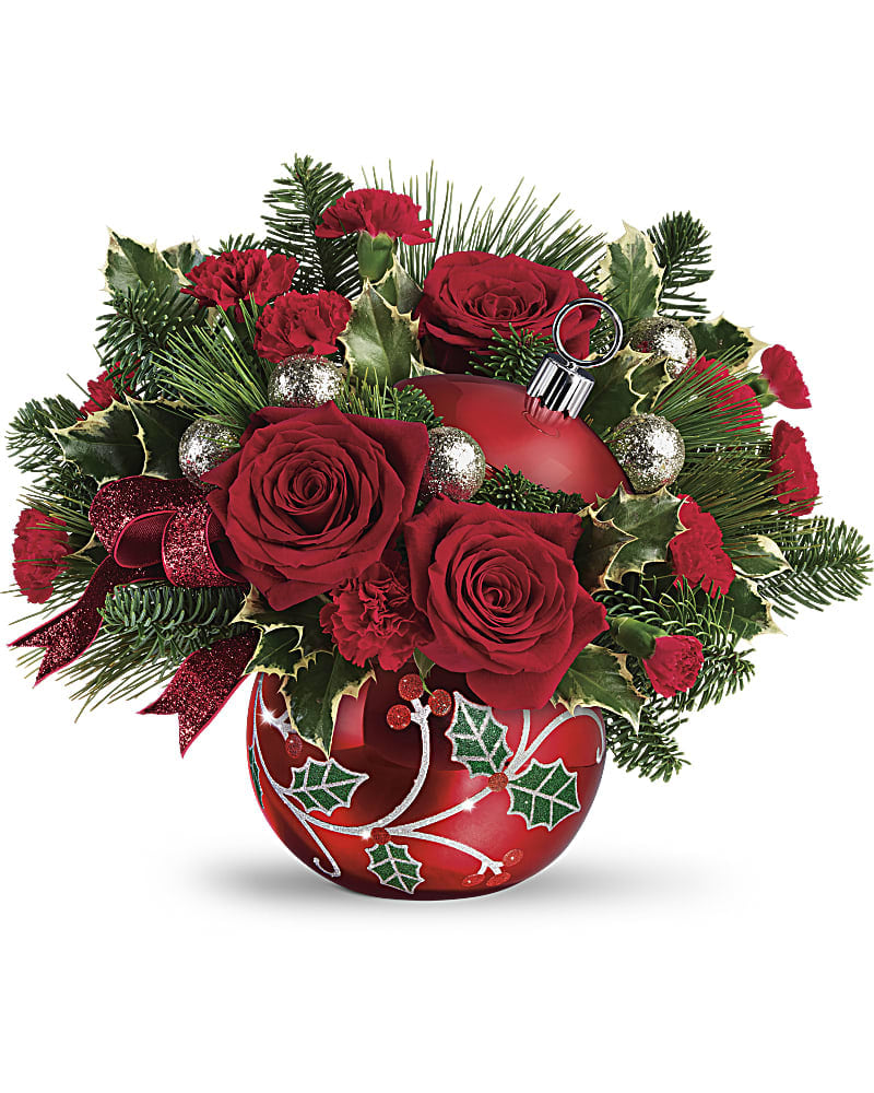 Teleflora's Deck The Holly Ornament Bouquet Teleflora's Deck The Holly Ornament Bouquet - Hand-glazed with a shimmering finish and jolly holly details, this keepsake ornament jar is a festive vase for a lush Christmas bouquet, then becomes a beloved home for holiday treats! This festive bouquet includes red roses, red miniature carnations, variegated holly, noble fir, and white pine. Delivered in Teleflora's Deck the Holly Ornament.