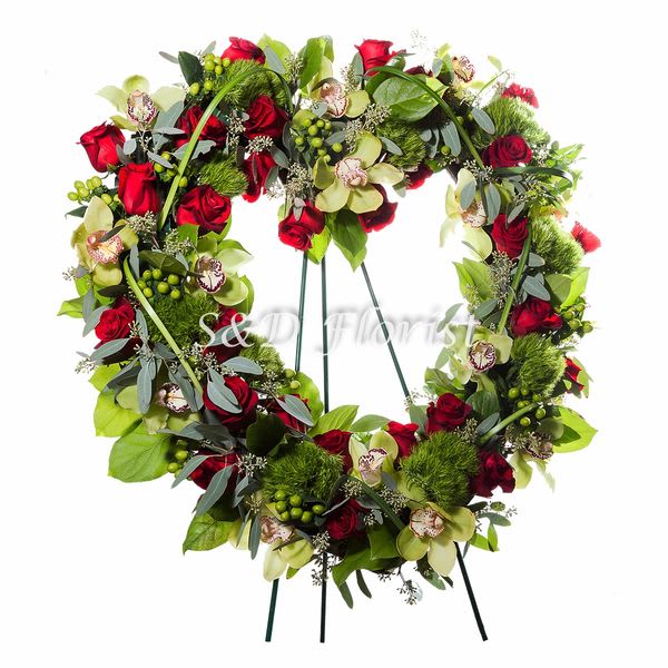 Red And Green Standing Heart Wreath - A 24&quot; open heart Wreath standing on a 66&quot; easel with red roses, green cymbidium orchid, green hypericum and seeded eucalyptus.  Dimensions: 32&quot;H x 32&quot;L