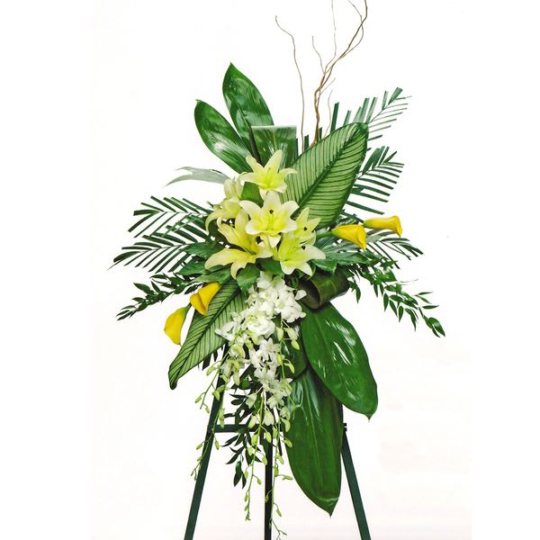 Simple Beauty Simple Beauty - Standing on a 77" easel is a spray of orchids, lilies, calla lilies and exotic greens. Dimensions: 46"H x 34"L