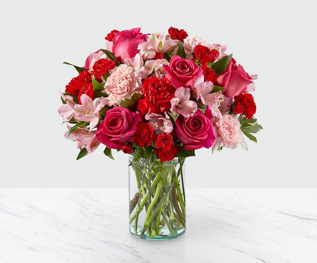 You're Precious™ Bouquet - Handcrafted and inspired by the gorgeous hues of the season, the You're Precious™ Bouquet is full of sweet sentiment for your favorite person. Hot pink roses, red carnations, pink alstroemeria, and pale pink carnations come together in a clear glass vase to make any room feel beautiful and light. From special birthdays to simply just because, this arrangement is a stunning gift to give your loved ones for every occasion.