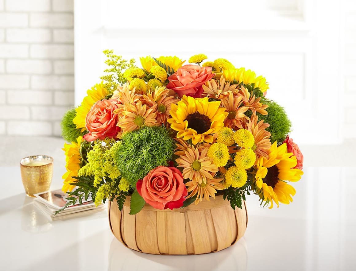 Harvest Sunflower Basket Harvest Sunflower Basket - Rustic, natural beauty and vibrant shades fill this arrangement. Our Harvest Sunflower Basket is the perfect mix of bold sunflowers, roses and dianthus in a natural woven basket.