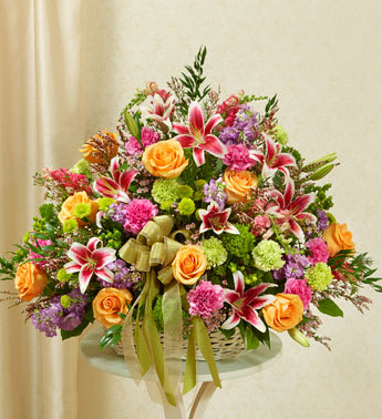 Pastel Sympathy Basket -  Product ID: 91404   Express your sympathy and compassion with this beautiful tribute arrangement of fresh pastel blooms. Fresh pastel-toned roses, lilies, stock, snapdragons, carnations, poms, heather and more, designed by our select florists in an elegant handled willow basket Friends, family and business associates can send this directly to the funeral home or to the family's home Our florists use only the freshest flowers available, so colors and varieties may vary Arrangement measures approximately 28âH x 24âL