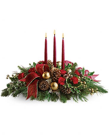 All Is Bright - All will be bright this season when you order this joyful Christmas arrangement. A lovely centerpiece, it will light up the holiday festivities beautifully. Miniature carnations are artfully on display with merry touches like shimmery ornaments, pinecones, berries, organza ribbon and holiday greens. Three graceful red taper candles add the perfect magical touch.