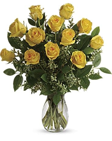 Say Yellow Bouquet - Here comes the sun! Say hello to a happy day with this grand bouquet of a dozen yellow roses and fresh greens in a graceful glass vase. This sunny arrangement features 12 yellow roses with oregonia and lemon leaf. Delivered in a glass jordan Vase.