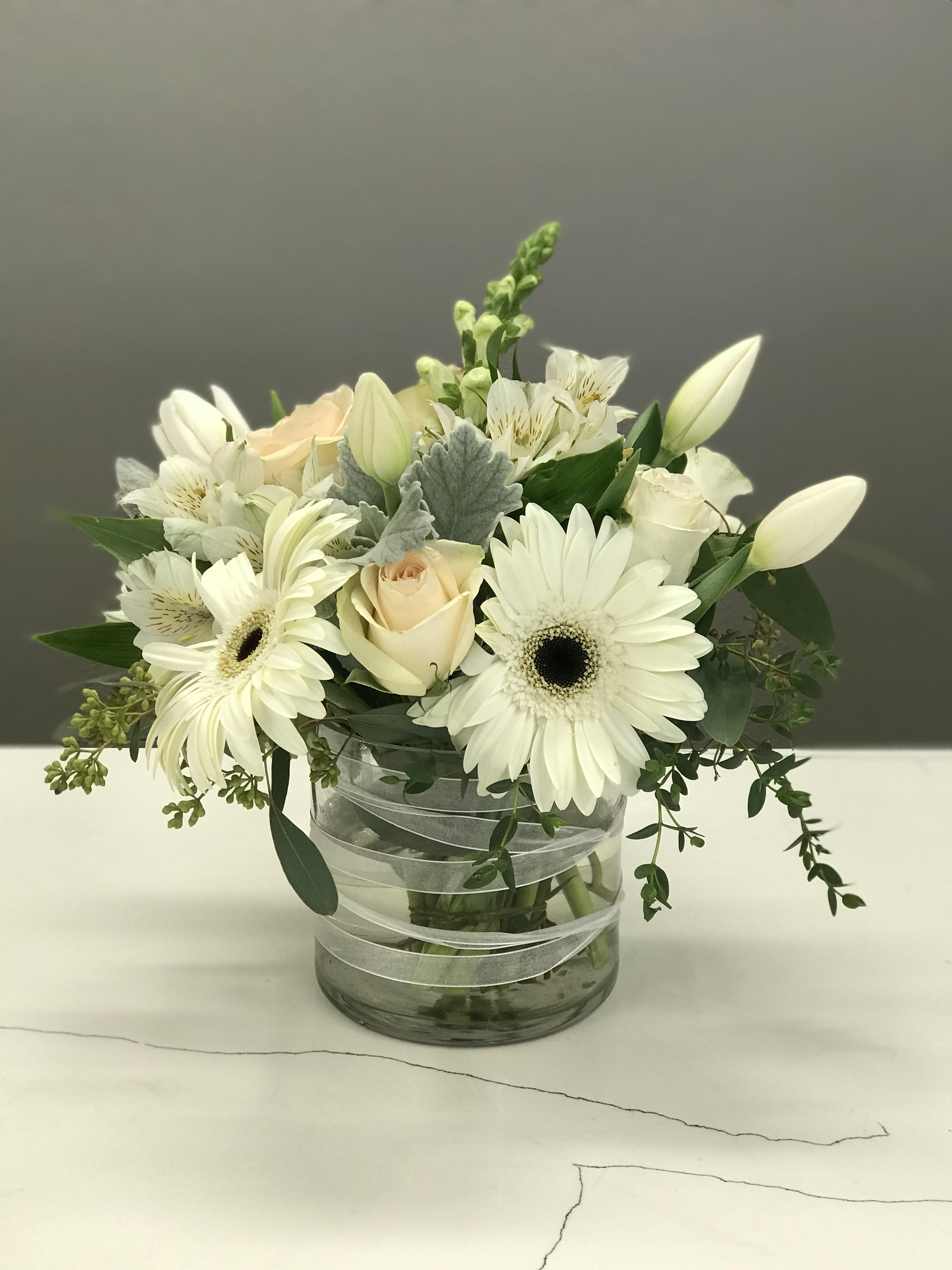 Pure Pleasures - Pure beauty and sweet innocence come to life in this dreamy collection of pearly white and pastel blooms.