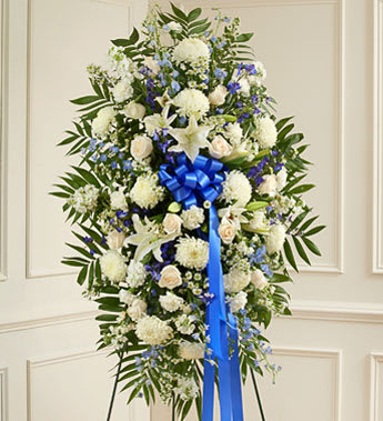 Deepest Sympathies Blue &amp; White Standing Spray - Product ID: 91287   Show all the love and compassion you have in your heart during times of loss with our beautiful blue and white standing spray. Gathered fresh with blue and white blooms, this expertly crafted arrangement is a tasteful and touching expression of your care and concern. Standing spray arrangement of fresh blue delphinium gathered with white roses, lilies, mums, stock, carnations and more Appropriate for family, friends or business associates to send directly to the funeral home Our florists use only the freshest flowers available, so colors and varieties may vary Large measures approximately 52&quot;H x 42&quot;L without easel Medium measures approximately 46&quot;H x 38&quot;L without easel Small measures approximately 42&quot;H x 30&quot;L without easel