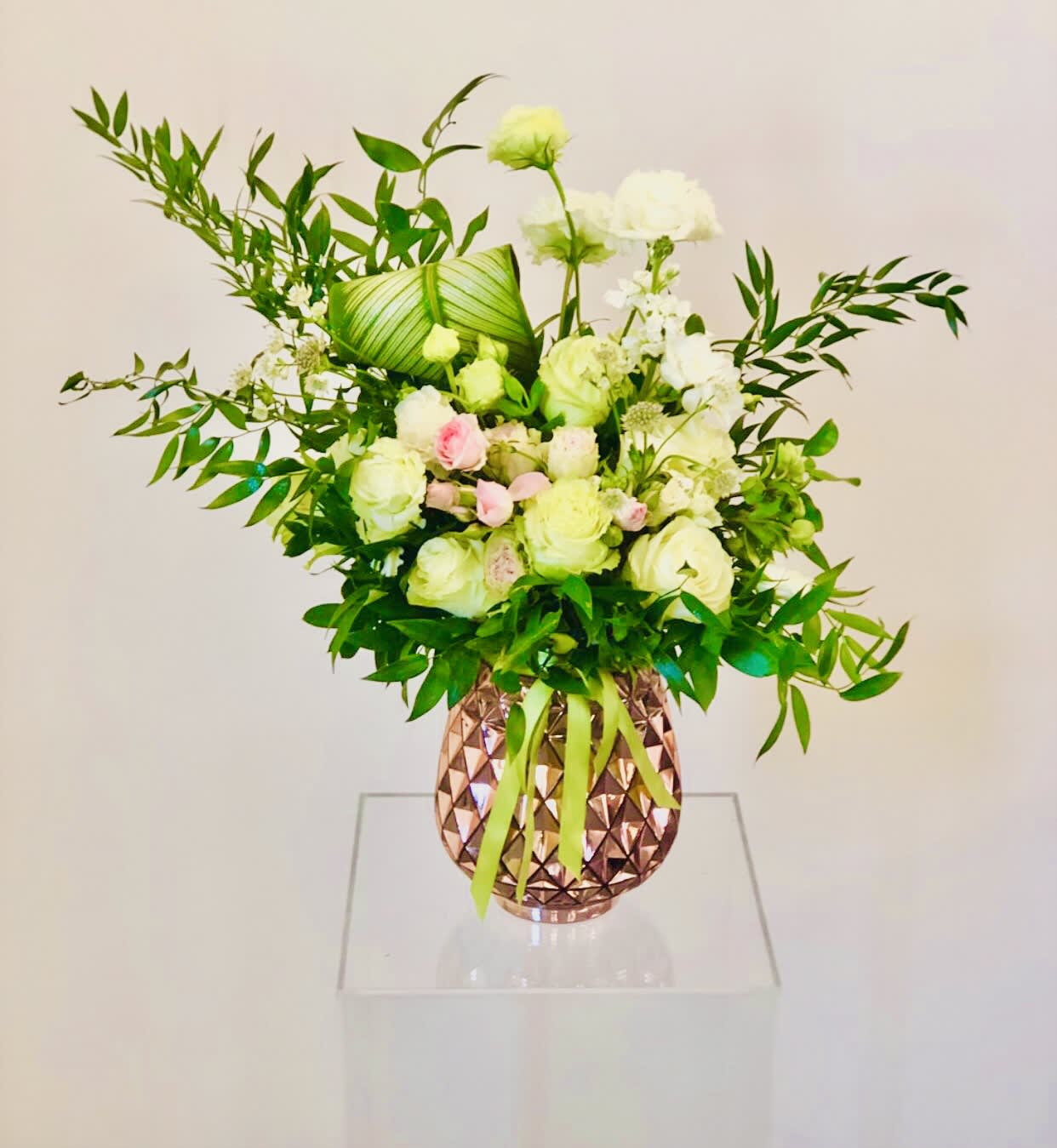 Gallantly Green - Beautiful display of light green and pink flowers - roses, spray roses, lisianthsus, alstroemeria.  Flowers set in a rose gold vase.  *Please view policy section regarding substitutions.