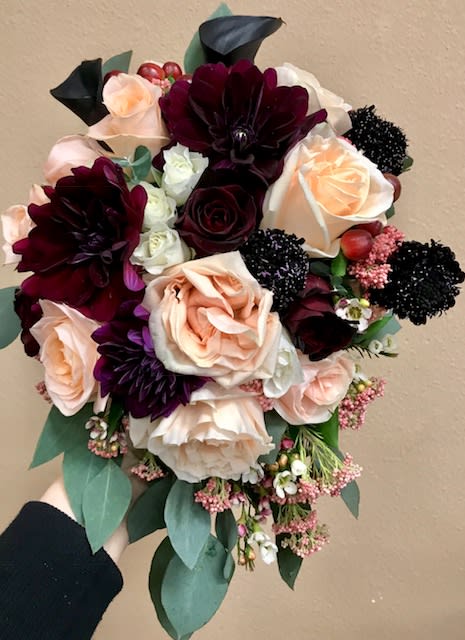 WBB-104 - Burgundy dahlias, black mini calla lilies, peach garden roses, blush roses, cosmo, hypericum, white spray roses, dark red roses, seeded eucalyptus and filler.