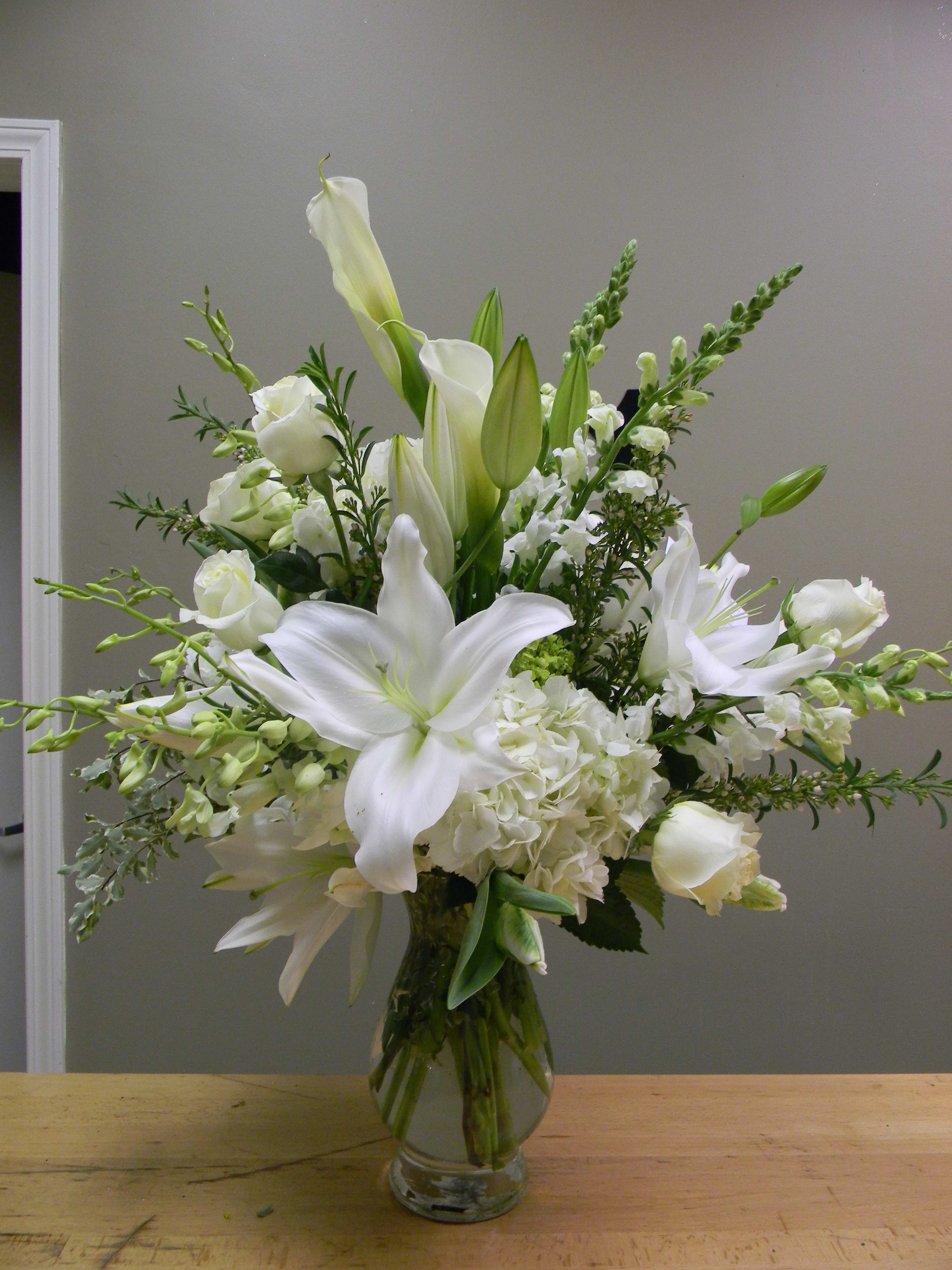 Orchids and Lilys - Vase of all white calla lilys, white oriental lilys with white orchids and hydrangea