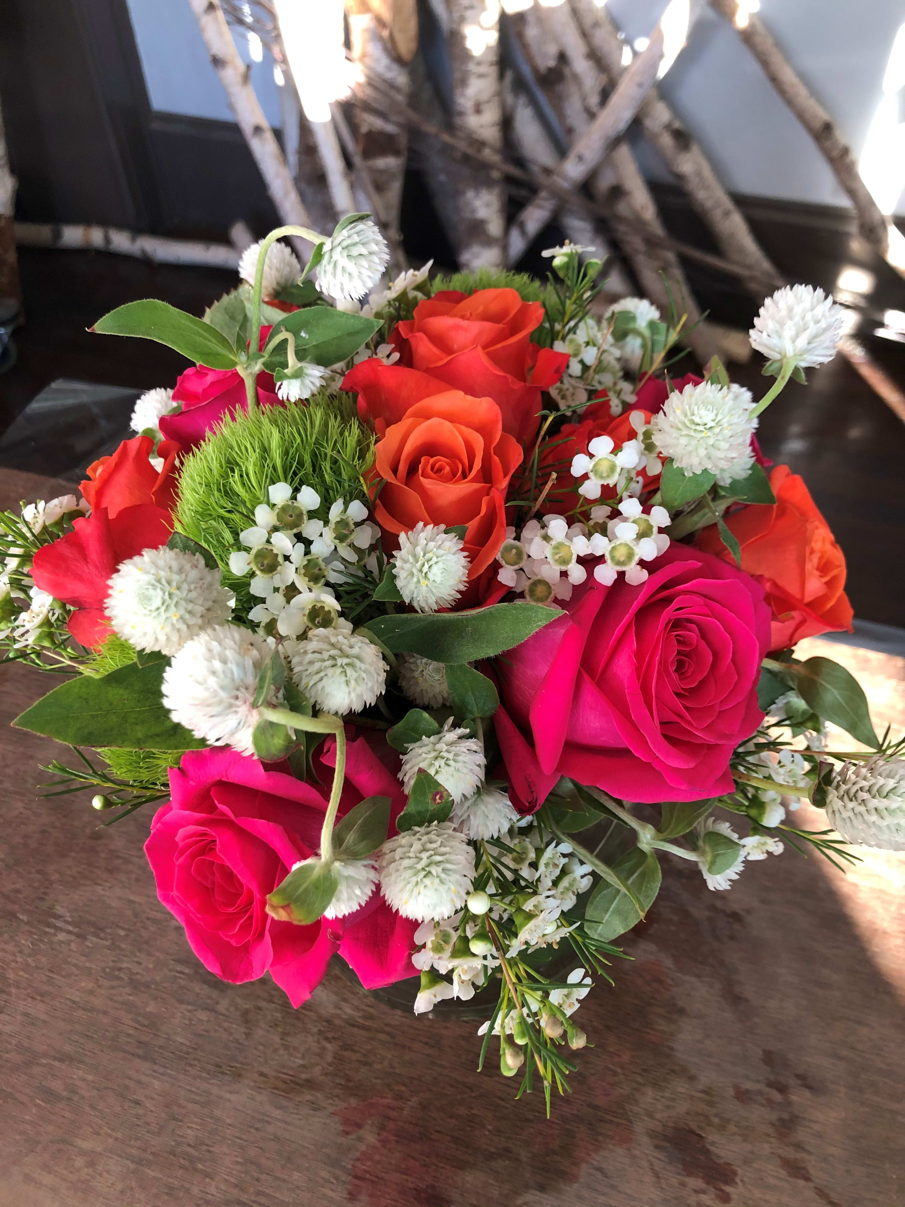 Rainbow Sherbet Rainbow Sherbet - Sweet and snappy with out hot pink and bright orange roses and touches of white, this will most certainly brighten someone's day!