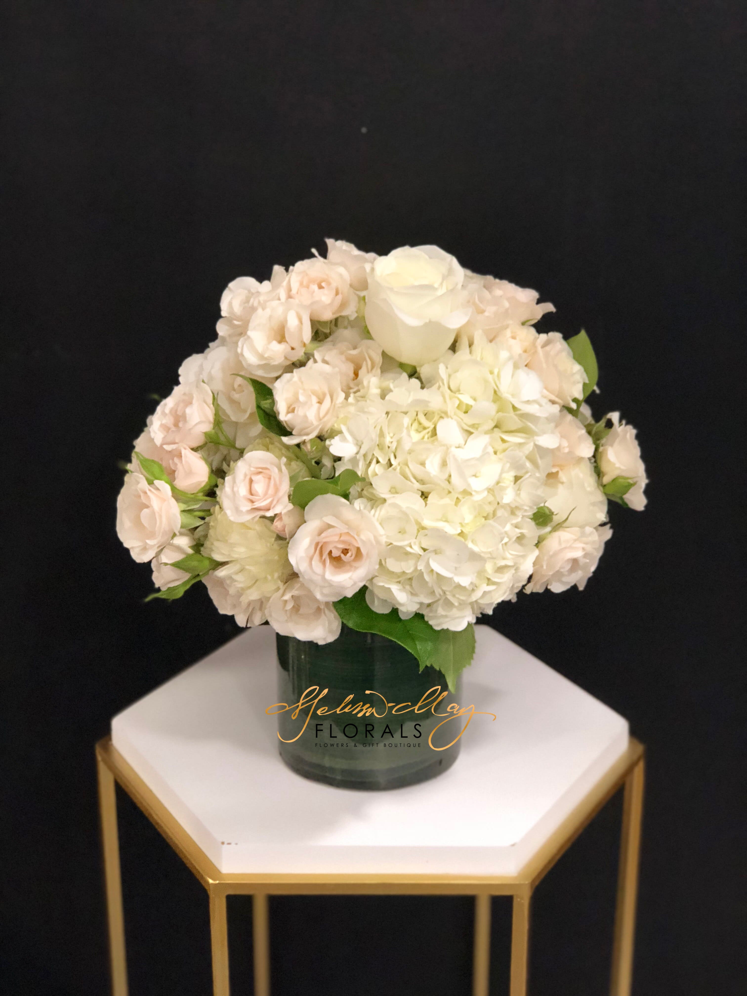 Snow White - Pearl-studded hydrangeas, white roses and spray roses. Show her that &quot;together&quot; is still where you love to be.