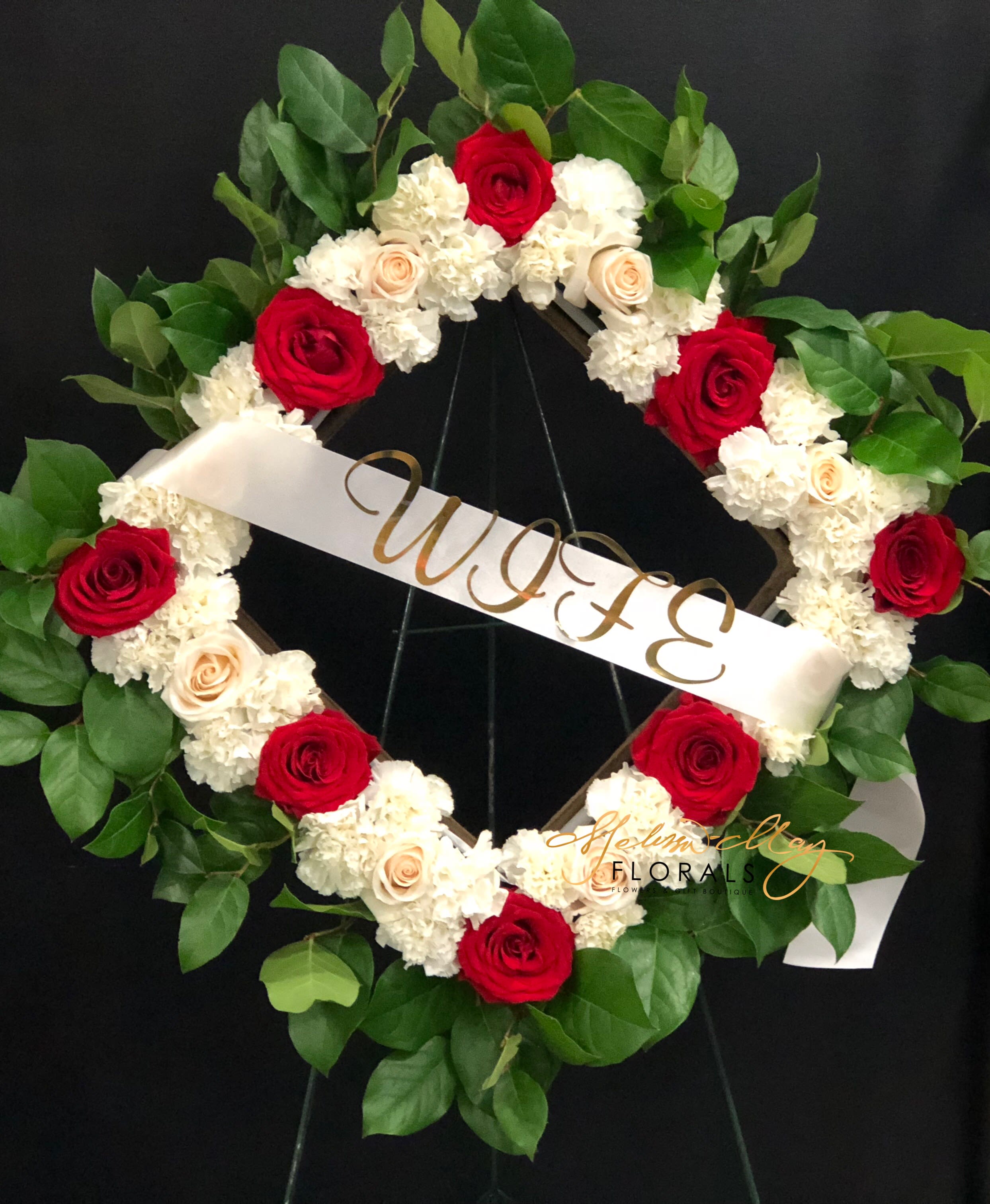 My World - Bring a sense of light even during the saddest moments of life. When you have this piece you can uplift the entire room. A standing spray will always make you remember the special moments. With red roses and white carnations to be there every step of the way. 