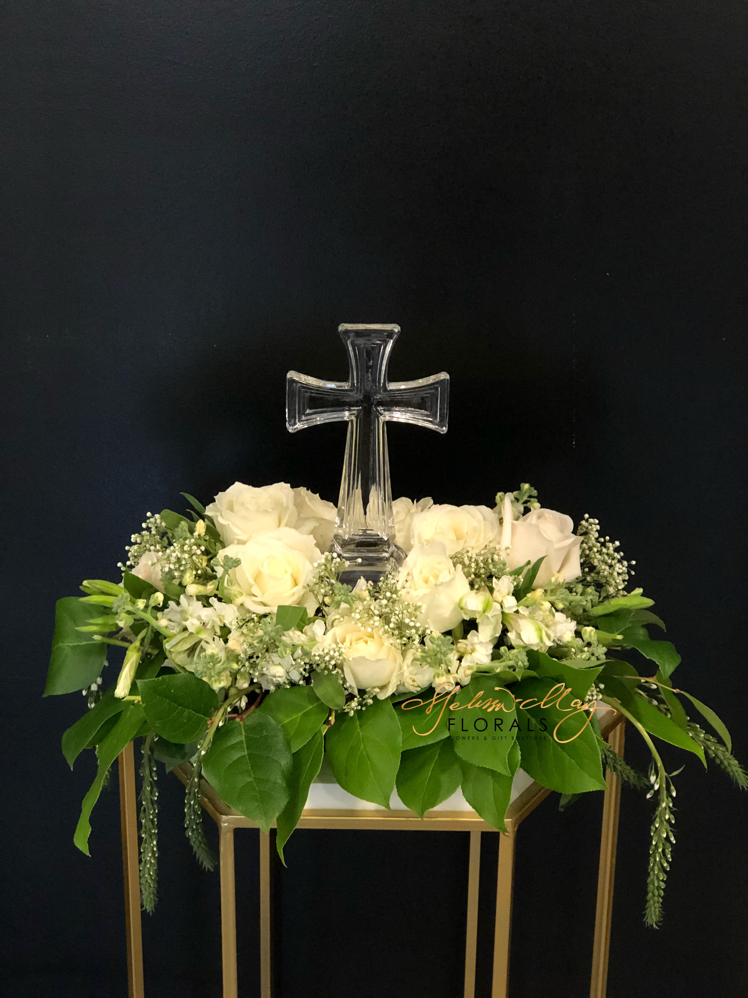 Sweet Blessings - It is nothing like having an arrangement that brings out positive feelings all around the house. Everyone will appreciate the love your home has to offer. With the Cross as the center and the lovely flowers of white roses and so much more.  