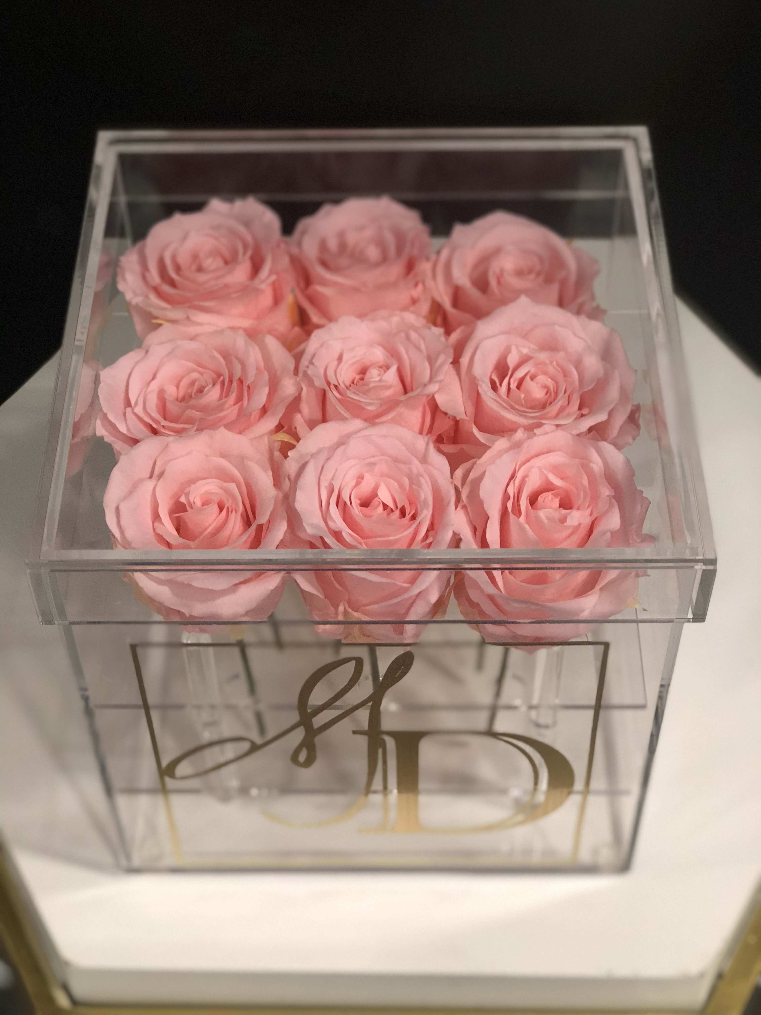 Floral Collection: Forever Love - We are excited to introduce you to our &quot;Flora Collection&quot; which is a part of Melissa-May Designs' home collection La Maison De Melissa-May. These exquisite beauties eternity roses are nestled in a square acrylic box that would surely provide a luxury feel to any home, office or event. Includes a written message. One year guaranteed lifespan for the long lasting roses without sunlight, water or excessive heat. 