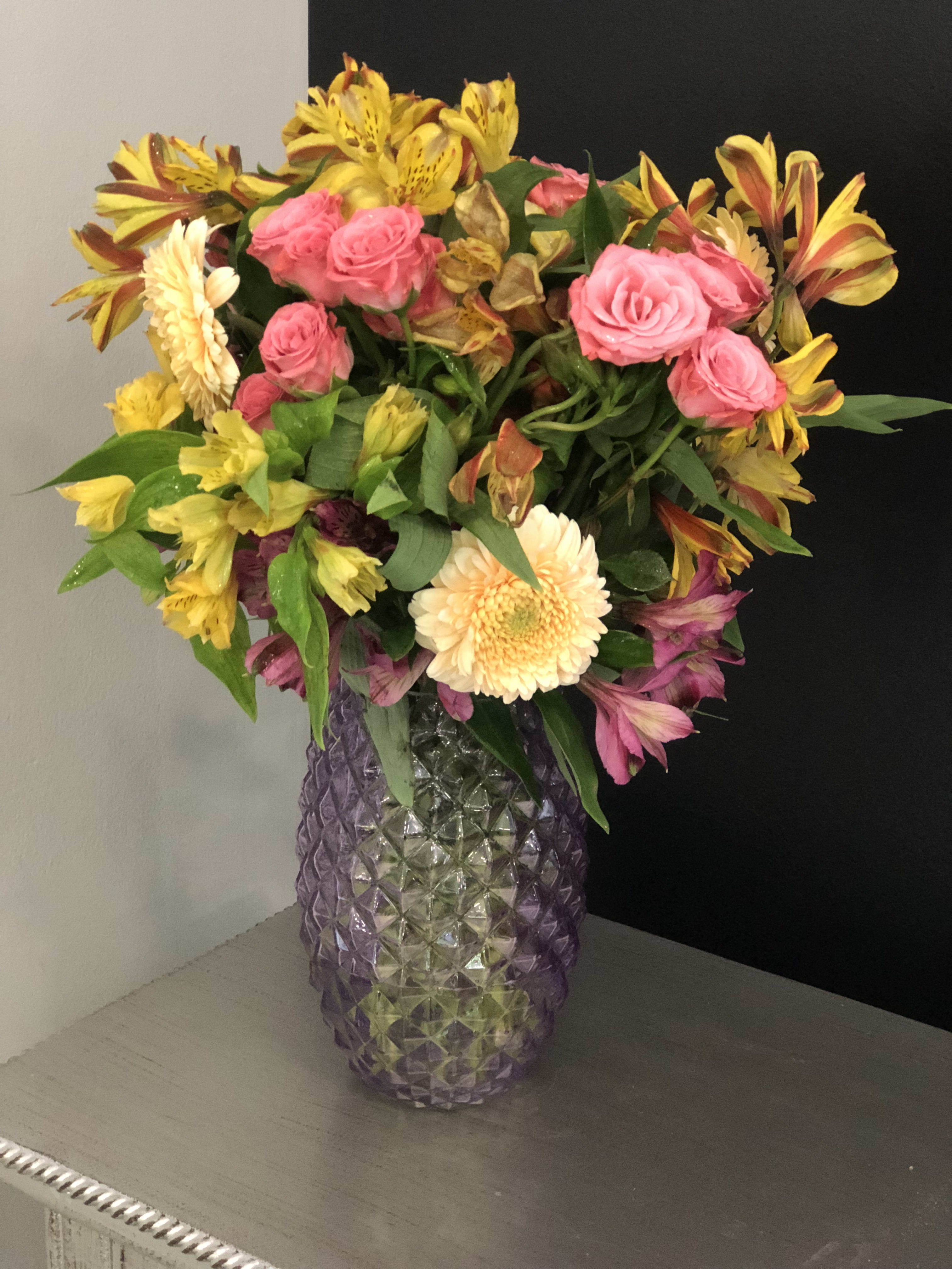 Be Sweet - She is always going to be the sweetest in the bunch. She will always be there will you walk up in the morning. She has pink alstroemerias, orange alstroemerias, pink spray roses, and gerber daisies. She will never disappoint with making anyone feel special. 