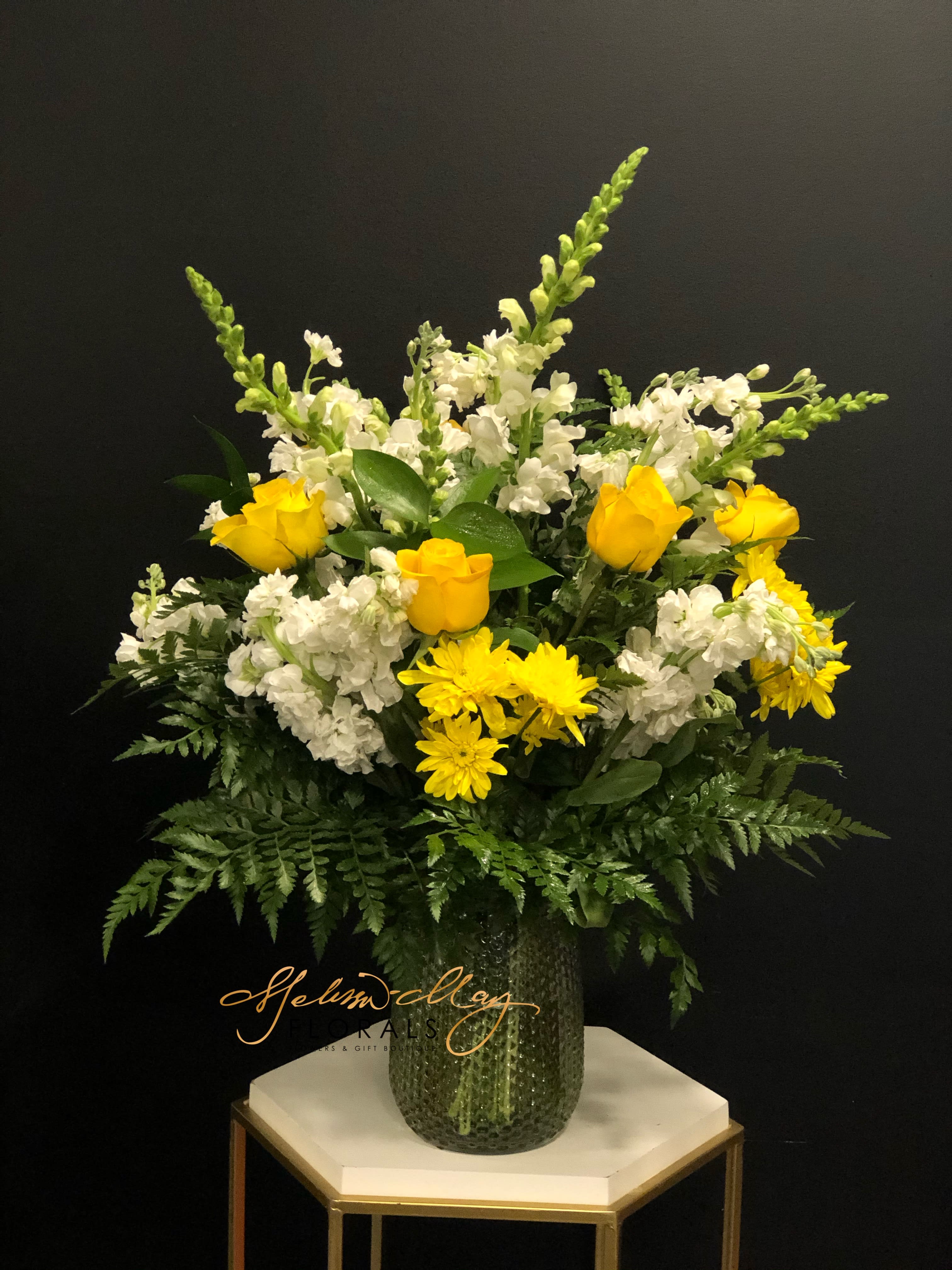 Ray of Sunshine - This is for the sunshine of your life. This arrangement has Bright yellow roses, fragrant stock and wild greens  