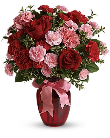 Dance with Me Bouquet  - Turn up the heat on your relationship with this sizzling bouquet of carnations and roses in a sparkling glass vase. It makes a spectacular gift for anniversary or any loving occasion.  A mix of carnations and roses in shades of red and light pink. Delivered in a glass vase accented with pink satin ribbon.  Approximately 14&quot; W x 16 1/2&quot; H