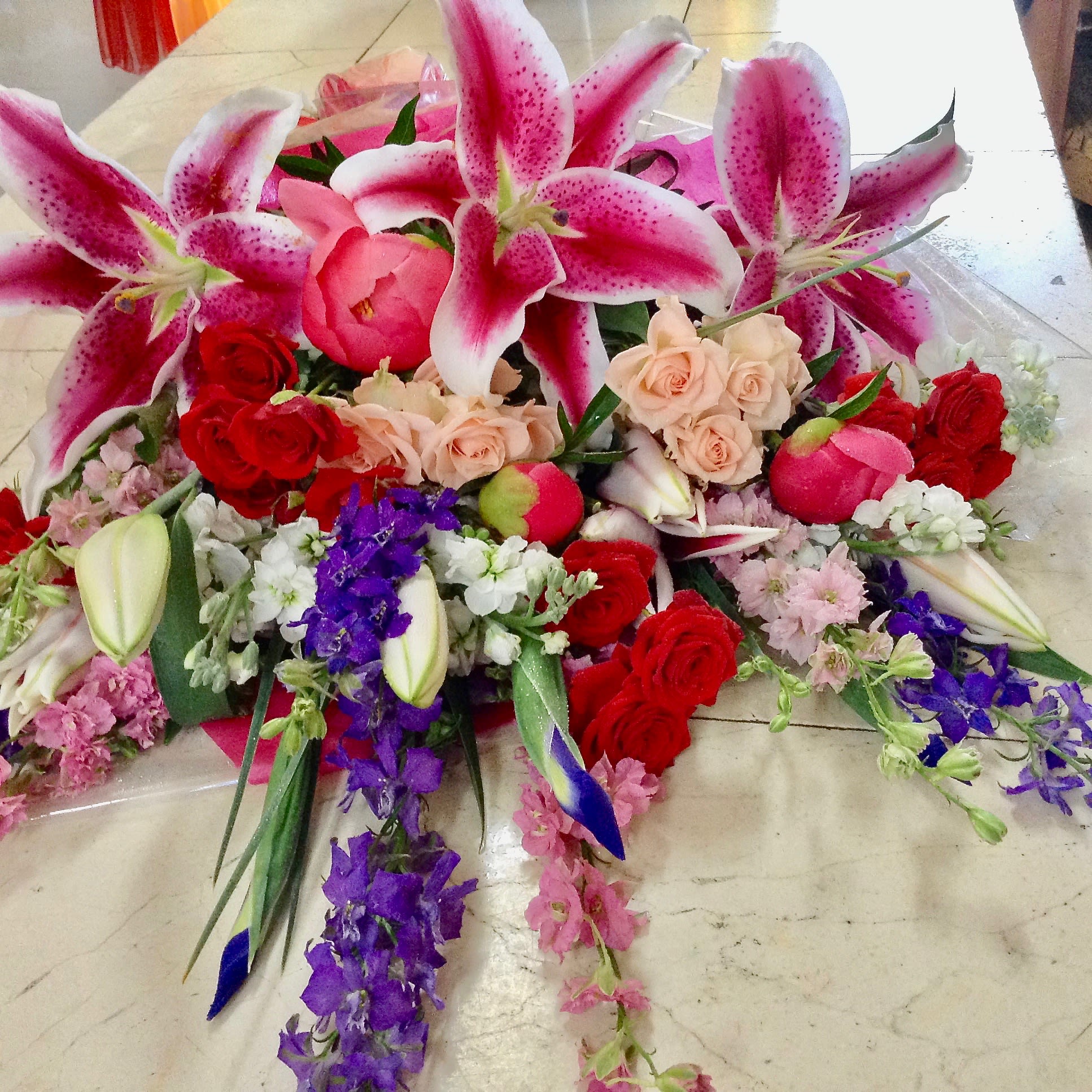 love in pink love in pink - Arm bouquet with stargazers, iris, delphinium, roses, larkspur, and peonies