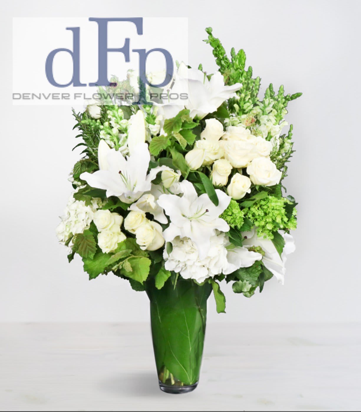 Large White Arrangement Large White Arrangement - A large white flower arrangement by Denver Flower Pros . This is a premium white flower arrangement, with premium white flowers. Good for a sympathy, at the funeral, or for somebody who adores white flowers. Arrangement is all round , about 4 feet high and 2 -3 feet wide