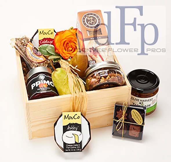 A Snooty Snacker Gift Crate. A Snooty Snacker Gift Crate. - <p>Denver Flower Pros offers this local Colorado Snack basket with 3 different local farmhouse cheeses, Fresh Fruit , Chocolates, Colorado Tapenade and Crackers , and a locally made Fruit preserve matching the cheese and local honey. The image shows the large size . The regular size has all the same items , smaller quantities. For larger baskets call the shop Nationwide shipping is available , please call the store.</p>