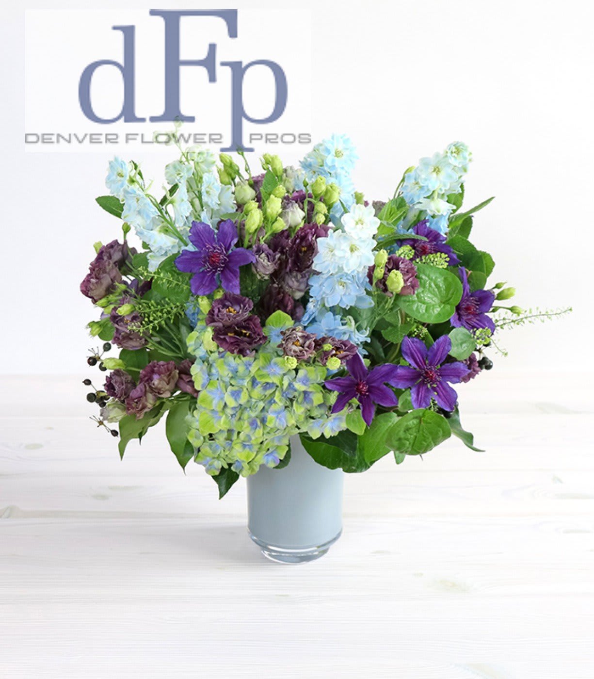 Summer purple and Blues flower arrangement with locally grown flowers Summer purple and Blues flower arrangement with locally grown flowers - <p>Denver Flower Pros offers this Flower arrangement and it is a favorite among our regular clients. This is a happy bright colored arrangement consists of Hydrangea , Calla's , Dahlia , Cottage Roses , Garden Lillie's and when available fresh mint. Brighten Somebodies day with this arrangement or send a thank you. This arrangement is available for same day delivery , but some substitutions might be necessary</p>