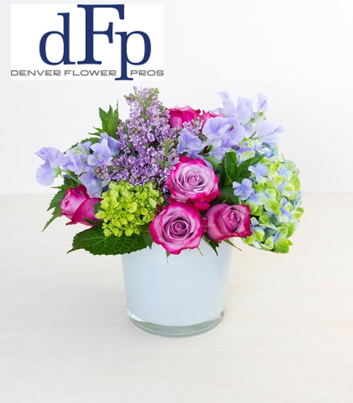 Lavender and Blue rose arrangement Lavender and Blue rose arrangement - <p>This arrangement consists of a rich variety of Azure , lavender and purple flowers . It gives a great opulent garden feeling , and can consist of . Garden roses , Hybrid Tea Roses ,Floribunda Roses, Sweet peas and Hydrangea , Mint. Colors in this arrangement are , lavender , light pink , light peach , and interesting greenery . Vase might be substituted to similar vase due to supply, as well as availability of some flowers.</p>