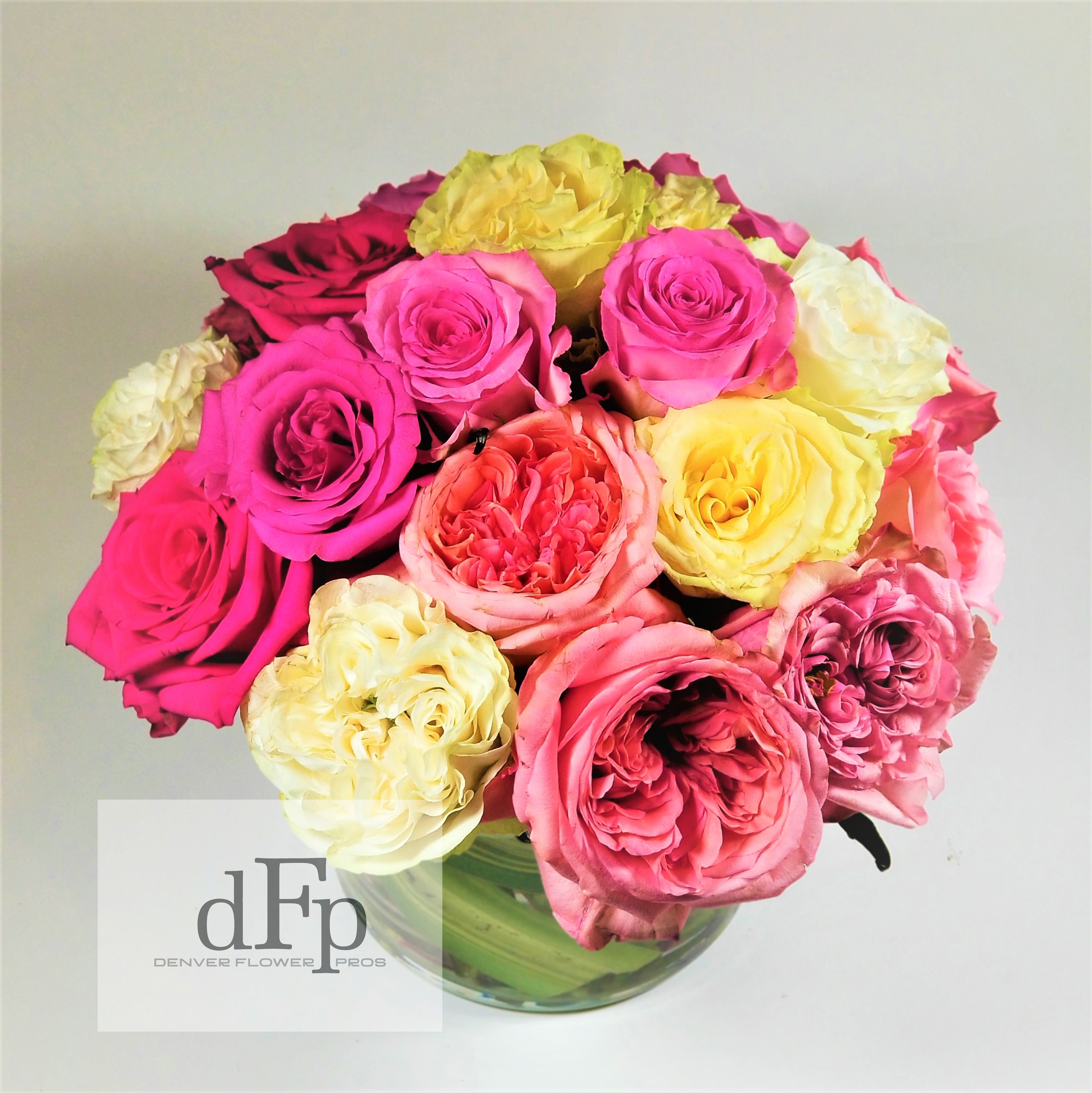 Garden Rose Pastel Arrangement - &lt;p&gt;In the French Pave style , a unique Rose arrangement with Fragrant Garden Roses , Premium roses and fantastic floribundas arranged with seasonable greens and berries . Approximately 12-14 by 12-14 inches . Arranged in a Glass Cylinder.&lt;/p&gt;