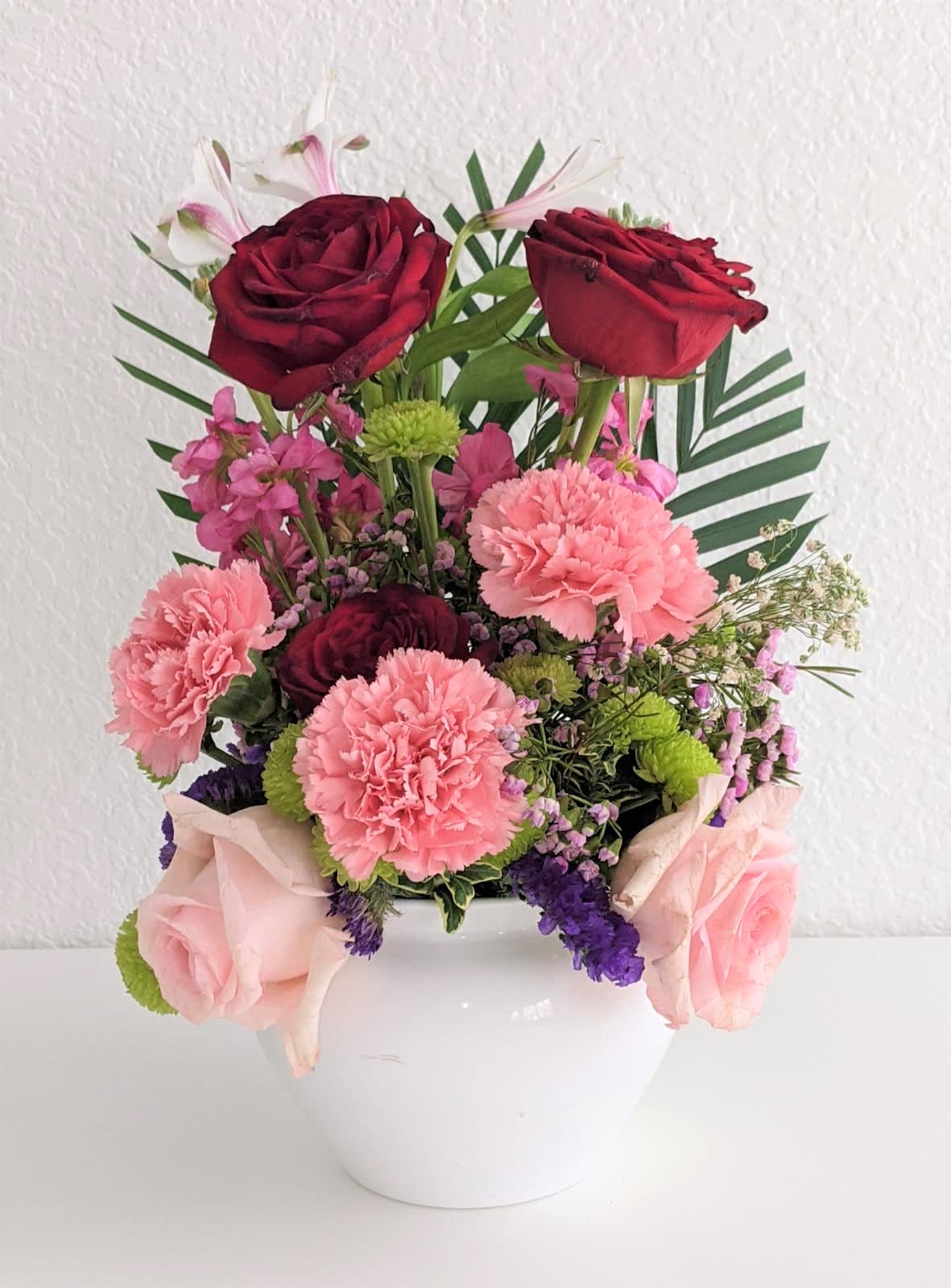 Bowl of Love by Flower Infinity  - A fresh medley bowl of roses, carnations, and other flowers in a smooth vase. 