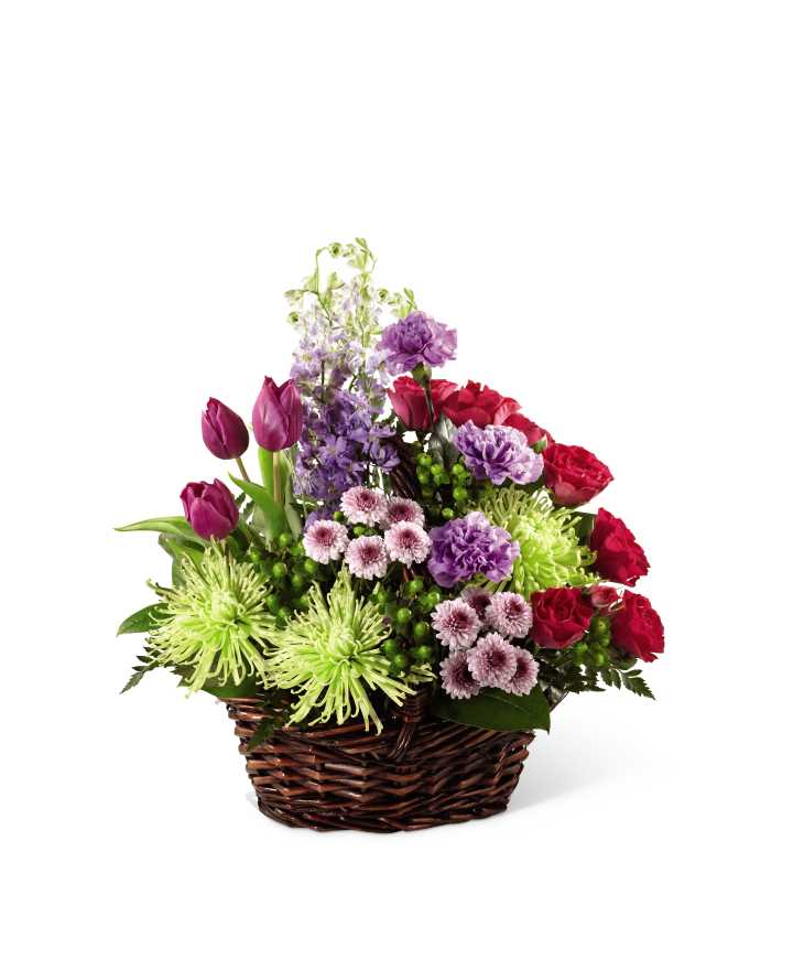 The FTD Truly Loved Basket - The FTD Truly Loved Basket exudes fantastic color, warmth and cheer to convey your most heartfelt sympathies for their loss. Purple tulips, fuchsia spray roses, lavender carnations, lavender larkspur, lavender button poms, jade spider chrysanthemums, green hypericum berries and lush greens are beautifully arranged in a brown willow basket to create a wonderful way to show how much you care.