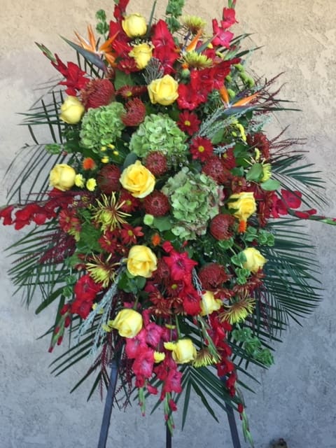 Autumn Grace Autumn Grace - A standing spray with grace and elegance. Rich colors and a grand selection of flowers to reflect your enduring love.
