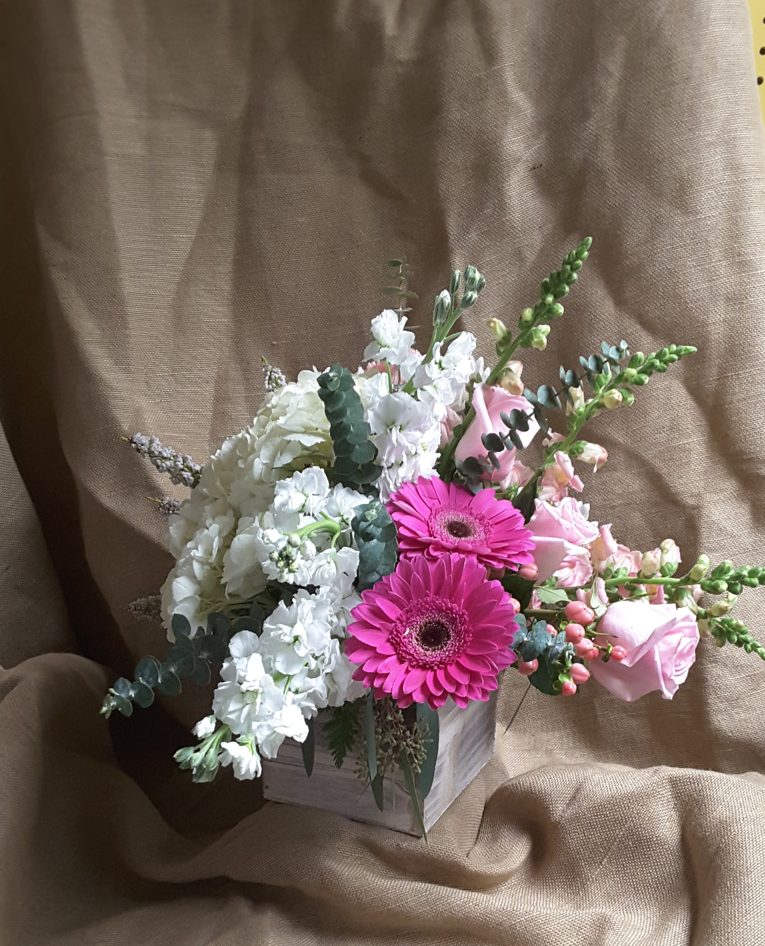 Country  Romance - Pink roses, pink gerberas with white hydrangea, white stock and  pink snap dragons  arranged in  a white washed wooden box  