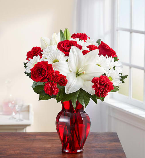 Red &amp; White Delight™ - EXCLUSIVE Delight them with red &amp; white. Our radiant new bouquet is a beautiful surprise for the one you love. Filled with lush blooms in classic romantic colors, this hand-gathered arrangement arrives in a striking ruby red vase, creating a memorable gift for an anniversary, or the everyday moments you want to hold onto forever.  