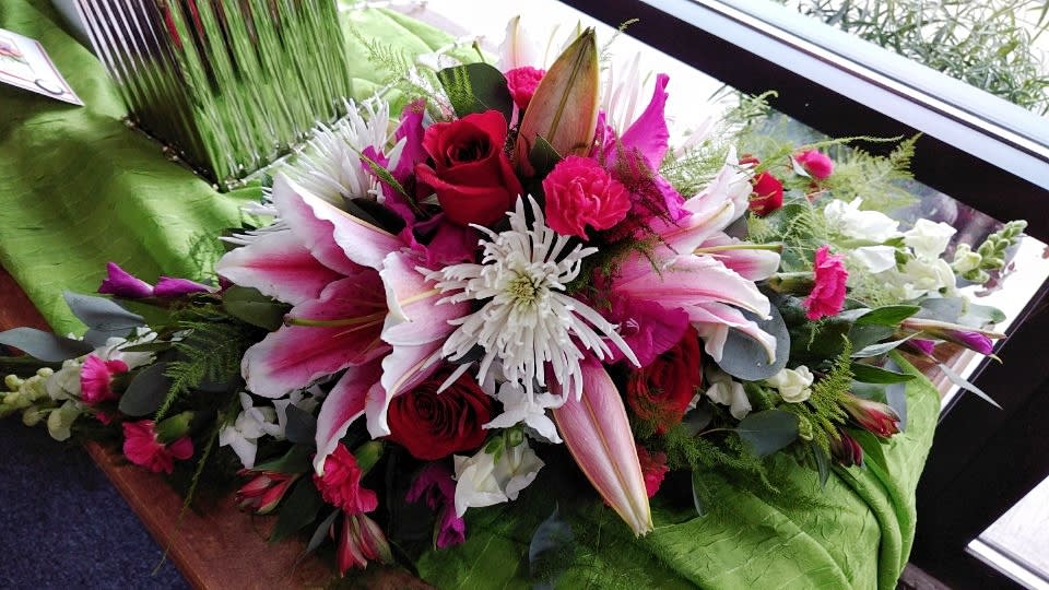 Sweet Little Love - This is one of our beautiful centerpiece arrangements, perfect for any and every occasion! Designed using Stargazer lilies, red roses, spider mums, carnations, gladiolus, snapdragons, and various filler greens. Dimension: 10&quot;x24&quot;