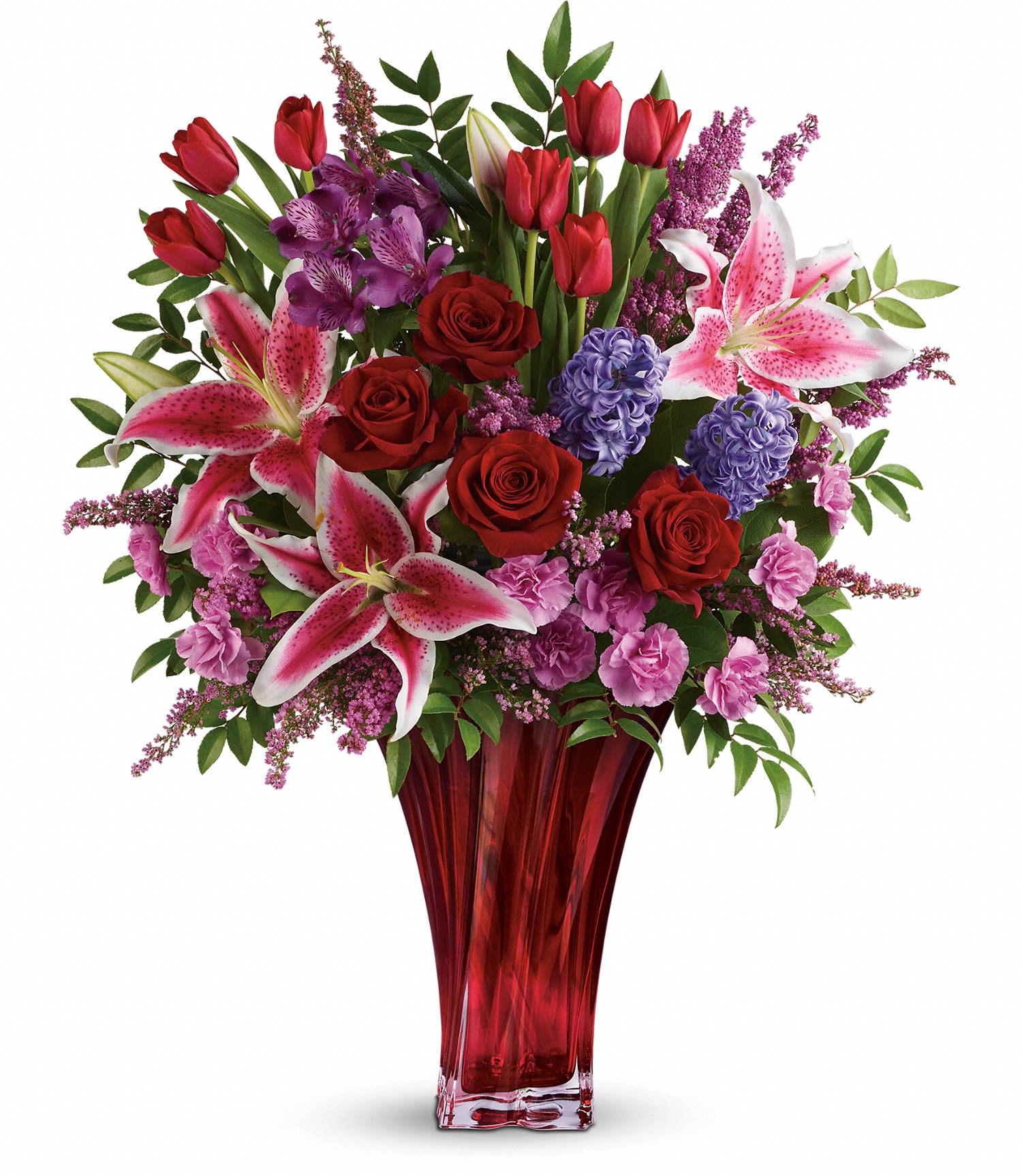 One Of A Kind Love Bouquet by Teleflora PM - For a love that's truly one of a kind. Celebrate your unique bond this Valentine's Day with this magnificent bouquet of roses, lilies, alstroemeria and more, artfully arranged in an elegant red blown-glass vase. Dazzling with graceful details, it's a true décor piece they'll enjoy forever as a resplendent reminder of your love. 