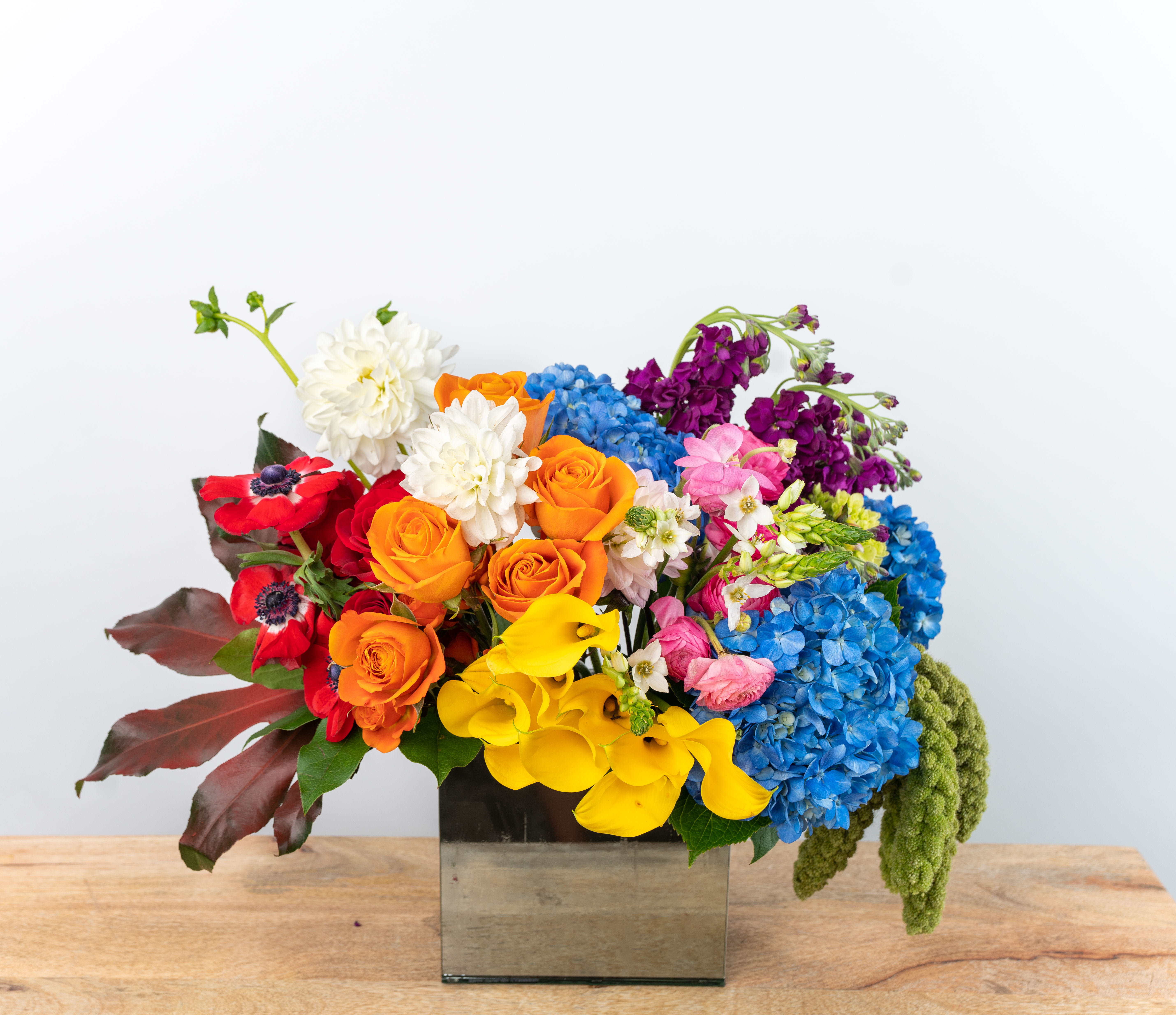 whimsical garden - A burst of color welcomes you in this design. Roses, ranuncula, calla lilies, and hydrangea are arranged elegantly in this fine selection. It will give anyone a big &quot;WOW!&quot; moment. 