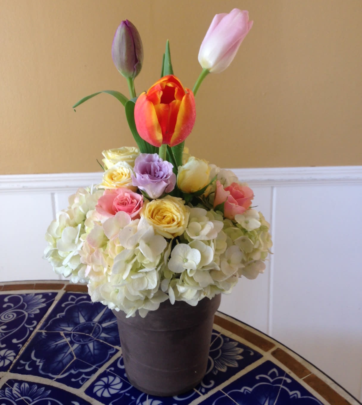 Spring rainbow - Lilies, colorful tulips, roses in clay pot