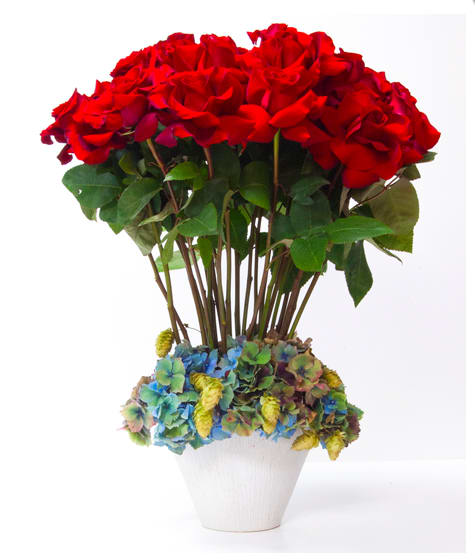 Modern Rose Masterpiece Modern Rose Masterpiece - This arrangement is made with two dozen Ecuadorian Red Roses, Hydrangeas, and other seasonal flowers freshly cut with greens in a glass vase ... Simply beautiful.